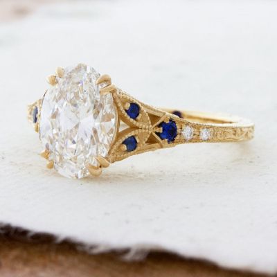 1.85 Carat Oval Cut Engraved Engagement Ring With Blue Sapphire Accents