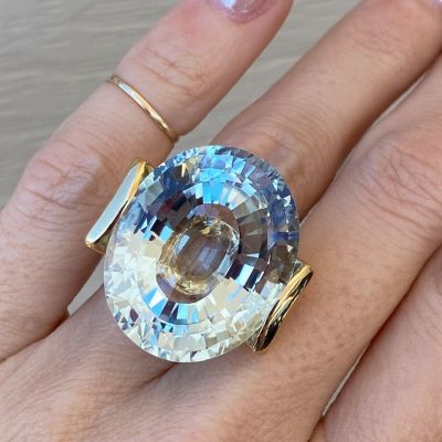 56.8 Carat Fine Quality Impressive Step Cut Oval Blue Topaz Ring