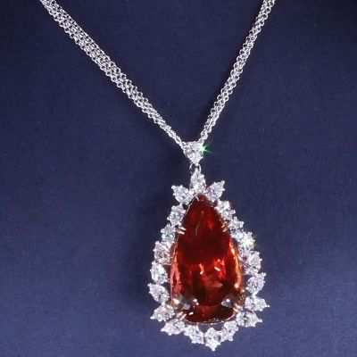 64ct Pear Cut Ruby With A White Sapphire Halo Pendant Necklace