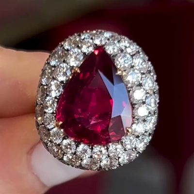7ct Pear Cut Ruby Set Within A Dome Of Round Cut White Sapphires Handmade Split Shank Ring