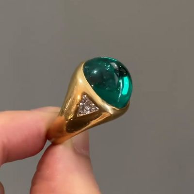 9.5ct Cabochon Emerald With with Triangular Cut White Sapphire Shoulders Yellow Gold Ring