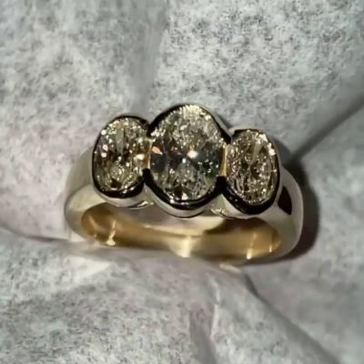 5ct Oval Cut White Sapphire Three Stone Bezel Set Yellow Gold Ring