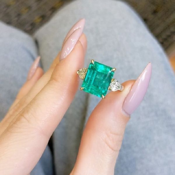 6.72 Carat Emerald Diamond Three Stone Ring